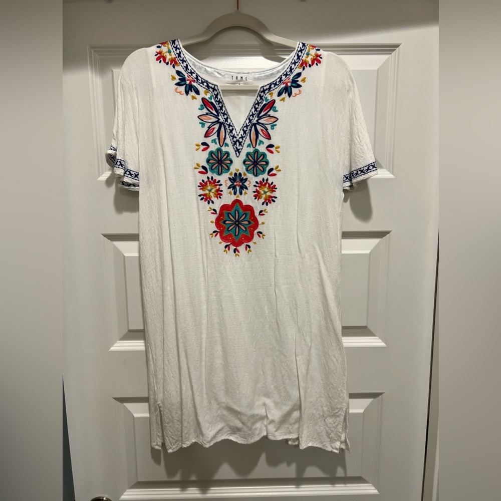 White dress with colorful embroidery